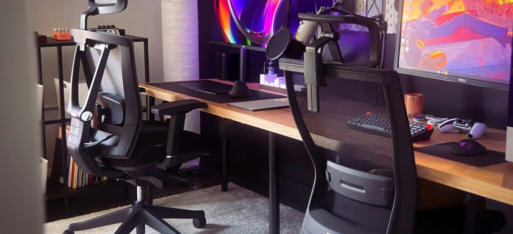 black office rolling chair beside brown wooden table